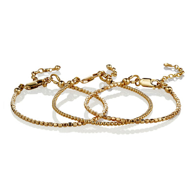 3 gorgeous delicate 14kt Gold-Fill stacking bracelets. Incredibly durable yet beautifully delicate these will last years!  2 featuring 2.4mm tiny faceted gold beads and another featuring even smaller 2mm gold beads hand-strung with great care on deceptively strong wire and finished with a lobster claw clasp and chain to adjust to any length.
